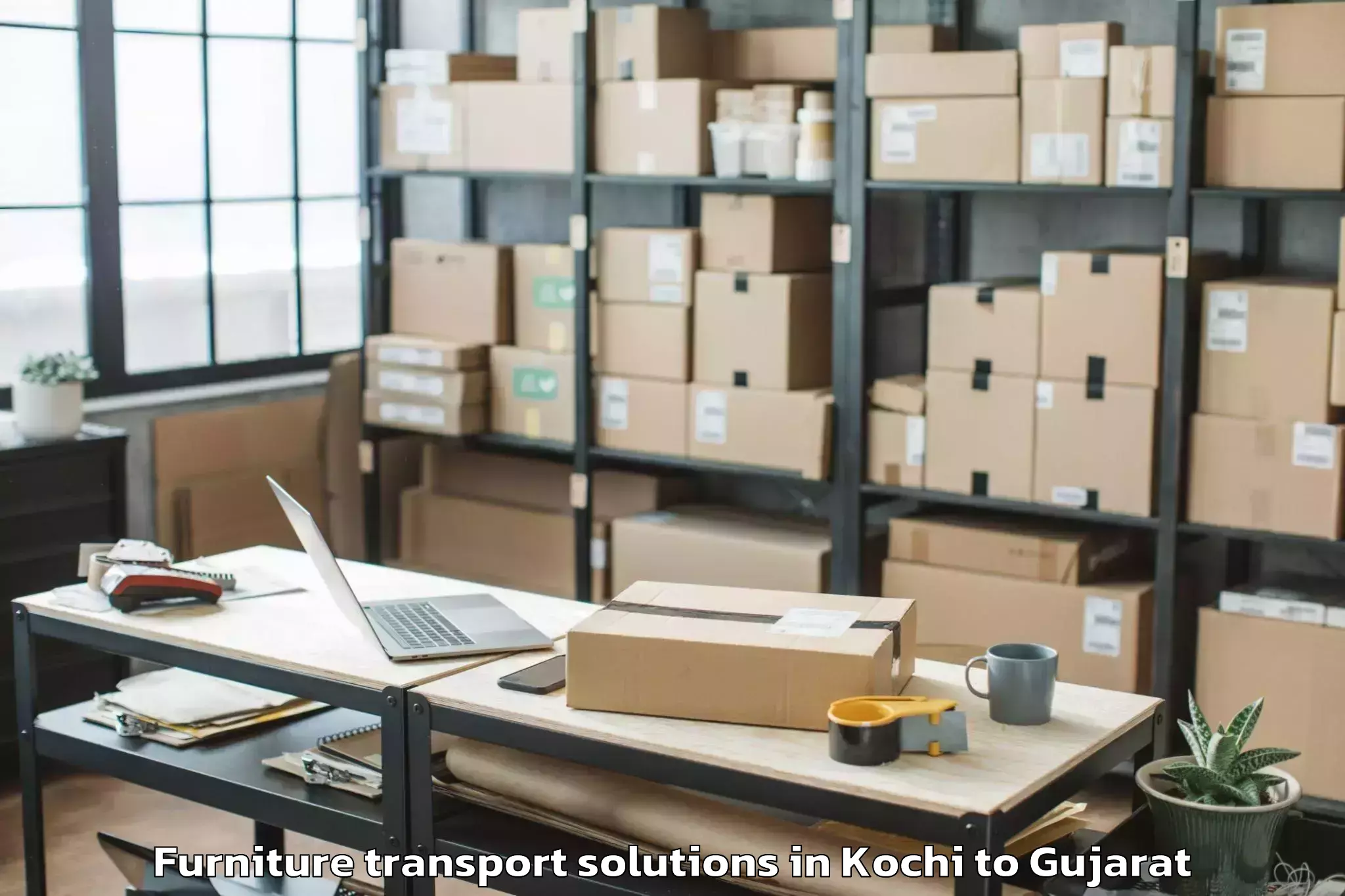 Book Kochi to Dhrol Furniture Transport Solutions